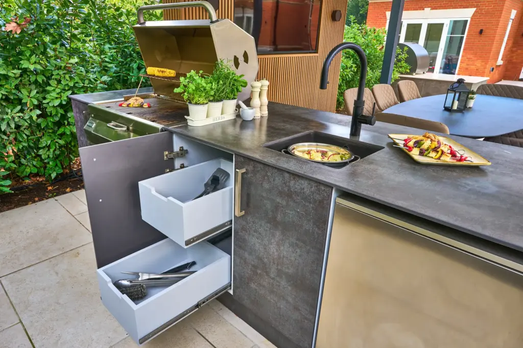 Pull out drawers in the cupboard of an outdoor kitchen