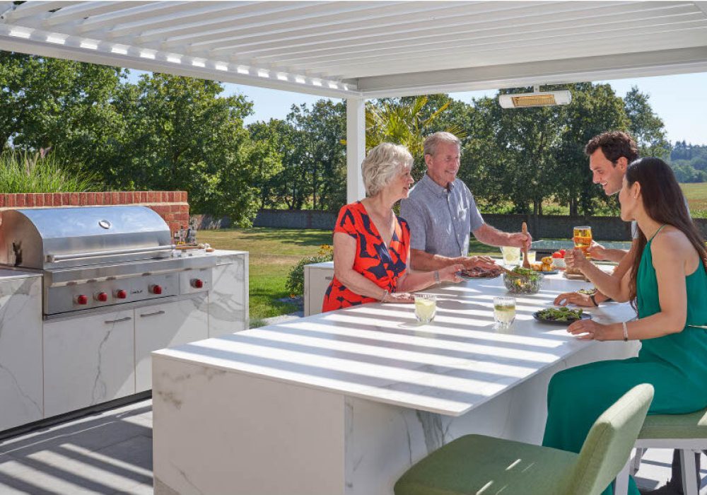 A family eating at an outdoor kitchen